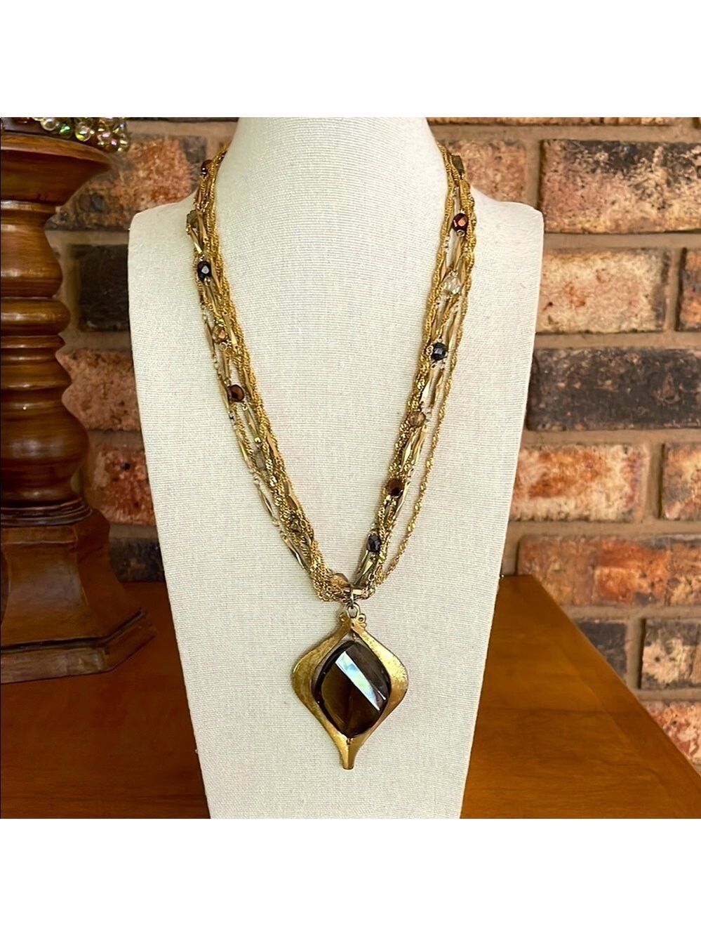 Jessica Simpson 7 strand gold tone statement necklace brown pendant and AB beads